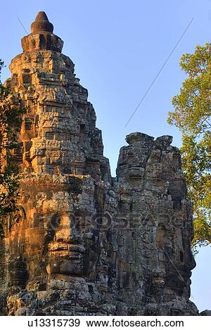 Stone heads on gate, Angkor Thom, Siem Reap, Cambodia View Large Photo Image Stock Photo - Stone heads on gate, Angkor Thom, Siem Reap, Cambodia. Fotosearch