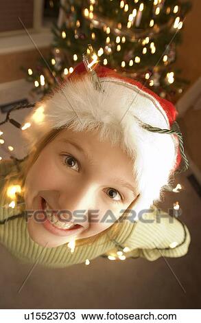 Teenager wearing a santa hat View Large Photo Image Stock Image - Teenager wearing a santa hat. Fotosearch