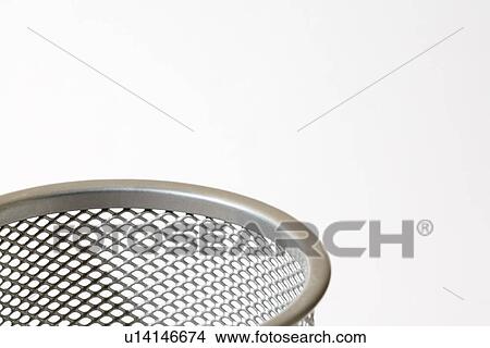 Picture - Top of mesh metal pencil holder. Fotosearch