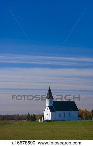 Stock Image - Traditional prairie steeple church in the morning . Fotosearch
