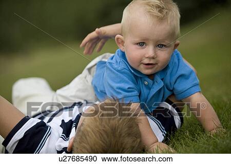 Stock Image - Two children playing together. Fotosearch