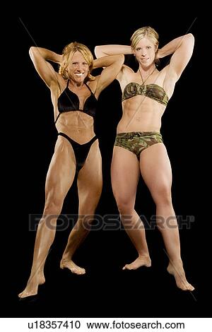 Stock Image - Two female bodybuilders. Fotosearch