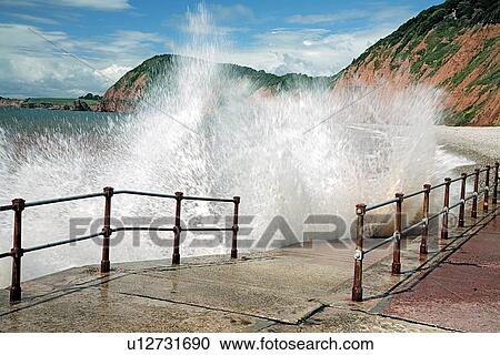 Waves crashing against walkway View Large Photo Image Stock Image - Waves crashing against walkway. Fotosearch