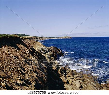 Waves crashing on rocky shore View Large Photo Image Stock Photograph - Waves crashing on rocky shore. Fotosearch
