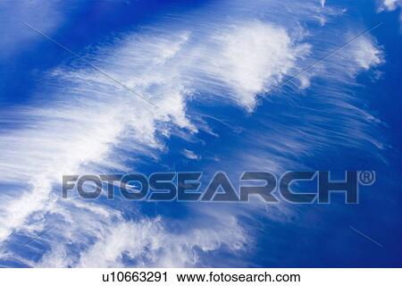 Stock Image - White clouds in the sky. Fotosearch