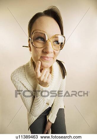Wide-angle view of a woman wearing eyeglasses View Large Photo Image Stock Image - Wide-angle view of a woman wearing eyeglasses. Fotosearch