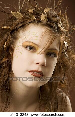 Woman dressed up as autumn View Large Photo Image Stock Photo - Woman dressed up as autumn. Fotosearch
