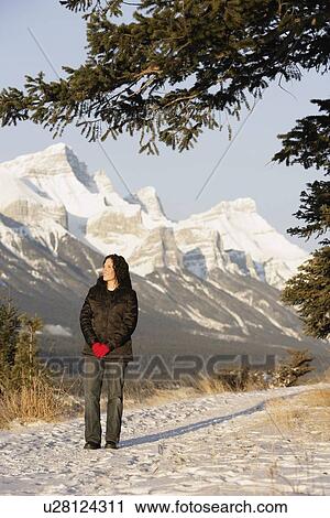 Woman enjoying the winter scene View Large Photo Image Stock Image - Woman enjoying the winter scene. Fotosearch