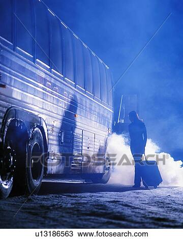 Woman getting on bus in winter View Large Photo Image Stock Image - Woman getting on bus in winter. Fotosearch