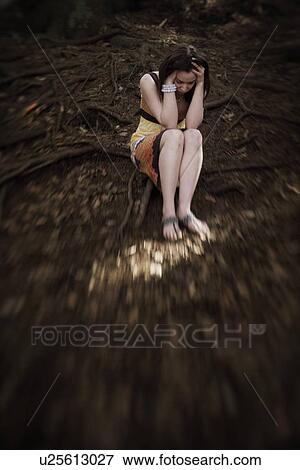 Woman holding head in hands View Large Photo Image Stock Photo - Woman holding head in hands. Fotosearch