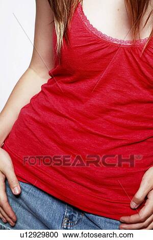 Stock Image - Woman in red sleeveless top. Fotosearch
