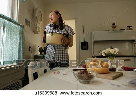 Woman in the kitchen in the 1940s View Large Photo Image Stock Photo - Woman in the kitchen in the 1940s. Fotosearch