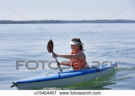 Woman kayaking View Large Photo Image Stock Image - Woman kayaking. Fotosearch