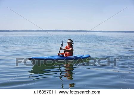 Woman kayaking View Large Photo Image Stock Image - Woman kayaking. Fotosearch