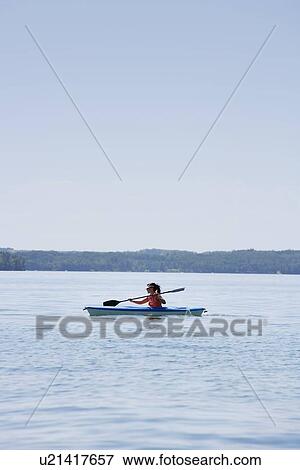 Woman kayaking View Large Photo Image Stock Photo - Woman kayaking. Fotosearch