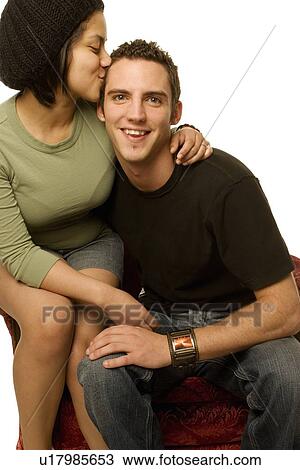 Woman kissing a man View Large Photo Image Stock Image - Woman kissing a man. Fotosearch