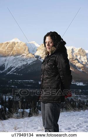 Picture - Woman standing on snow. Fotosearch