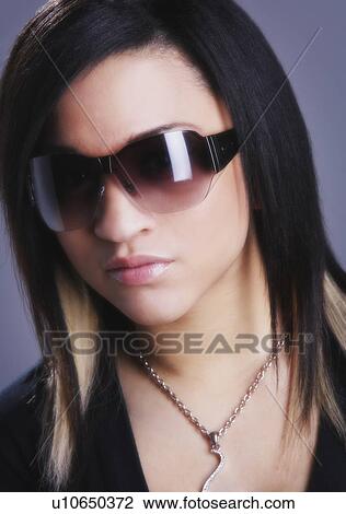 Woman wearing sunglasses View Large Photo Image Stock Image - Woman wearing sunglasses. Fotosearch