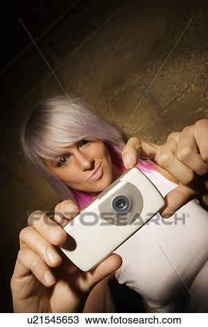 Woman with digital camera View Large Photo Image Stock Image - Woman with digital camera. Fotosearch