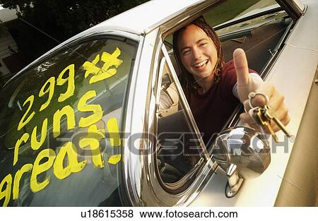 Young adult happy with first car View Large Photo Image Stock Photo - Young adult happy with first car. Fotosearch