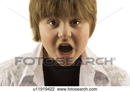 Young boy with mouth open looking surprised View Large Photo Image Stock Image - Young boy with mouth open looking surprised. Fotosearch