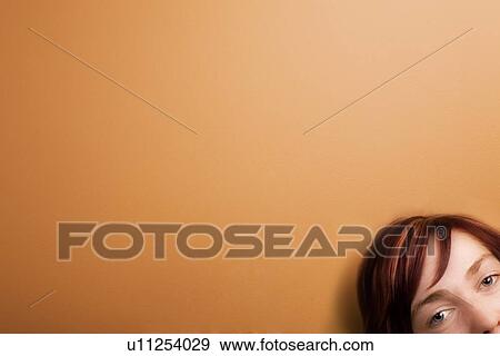 Young woman looking at camera View Large Photo Image Stock Photo - Young woman looking at camera. Fotosearch