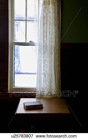 Stock Photo - A Bible on a table. Fotosearch