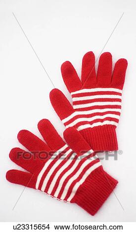 A pair of red and white gloves laying on the snow View Large Photo Image Picture - A pair of red and white gloves laying on the snow. Fotosearch
