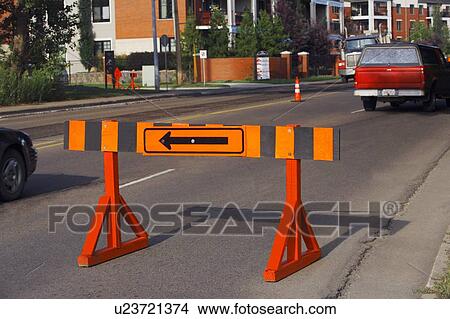 Barricade with a detour arrow on it View Large Photo Image Picture - Barricade with a detour arrow on it. Fotosearch