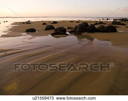 Stock Image - Beach with rocks, Kaui, Hawaii. Fotosearch