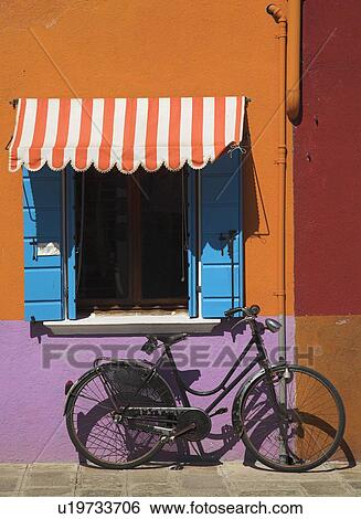 Stock Photograph - Bicycle in Burano, Italy. Fotosearch