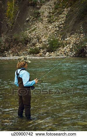 Boy fly fishing, Nordegg, Alberta, Canada View Large Photo Image Stock Image - Boy fly fishing, Nordegg, Alberta, Canada . Fotosearch