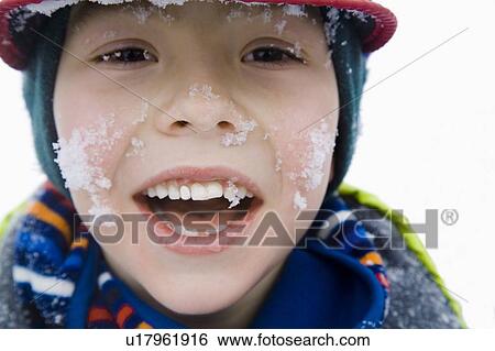 Boy with snow on face View Large Photo Image Stock Photograph - Boy with snow on face. Fotosearch