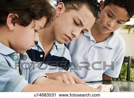 Boys reading together View Large Photo Image Stock Image - Boys reading together. Fotosearch