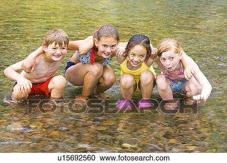 Children playing in water View Large Photo Image Stock Image - Children playing in water . Fotosearch