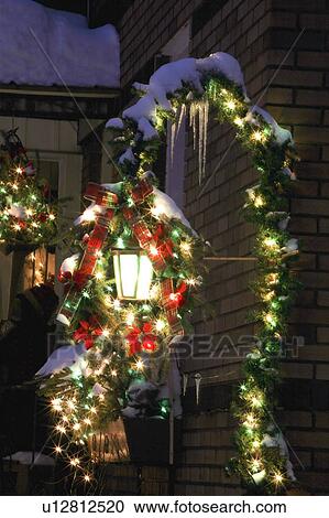 Stock Image - Christmas decorations outside of the house. Fotosearch