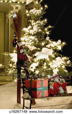 Stock Photo - Christmas gifts and skis. Fotosearch