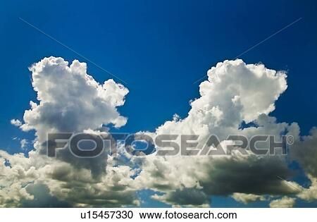 Clouds in the blue sky View Large Photo Image Stock Image - Clouds in the blue sky. Fotosearch