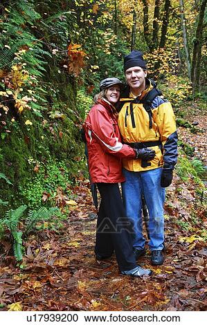 Couple hiking in the woods View Large Photo Image Stock Image - Couple hiking in the woods. Fotosearch