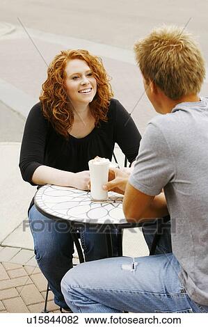 Couple sitting together View Large Photo Image Stock Image - Couple sitting together. Fotosearch