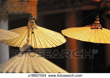 Gold, Asian umbrellas View Large Photo Image Picture - Gold, Asian umbrellas. Fotosearch