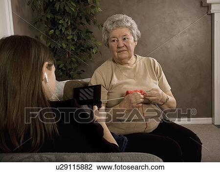 Stock Image - Grandchild and Grandmother spending time together. Fotosearch