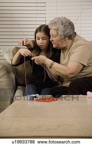 Stock Photo - Grandmother and granddaughter knitting. Fotosearch