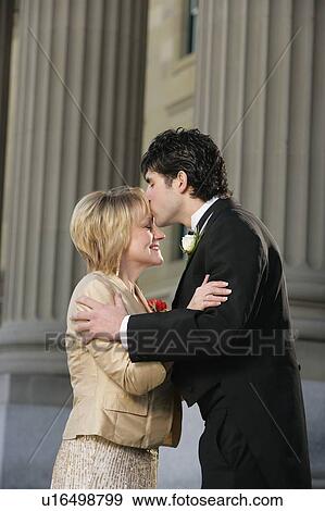Groom kissing his mother View Large Photo Image Stock Photo - Groom kissing his mother. Fotosearch