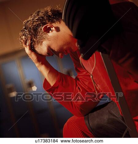 Picture - Hockey player in dressing room. Fotosearch