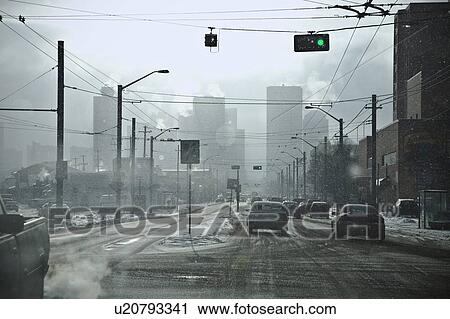 Intersection with traffic going through green light View Large Photo Image Stock Image - Intersection with traffic going through green light. Fotosearch