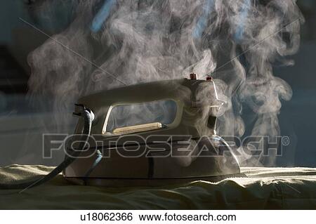 Stock Photograph - Iron burning clothing item. Fotosearch