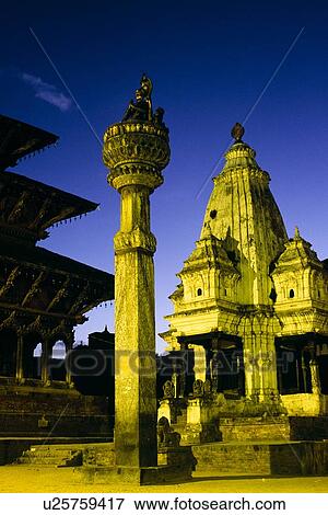 Stock Photo - King Yoganarendra Malla statue at night, Patan, Nepal. Fotosearch