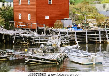 Lobster traps and boat, Newfoundland, Canada View Large Photo Image Stock Image - Lobster traps and boat, Newfoundland, Canada. Fotosearch