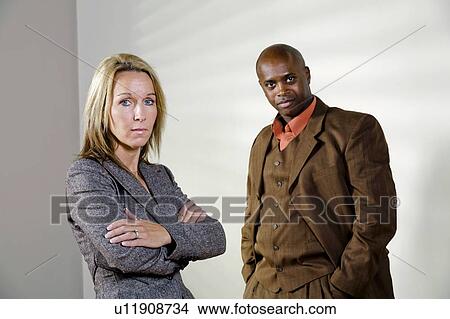 Picture - Man and woman looking stern. Fotosearch